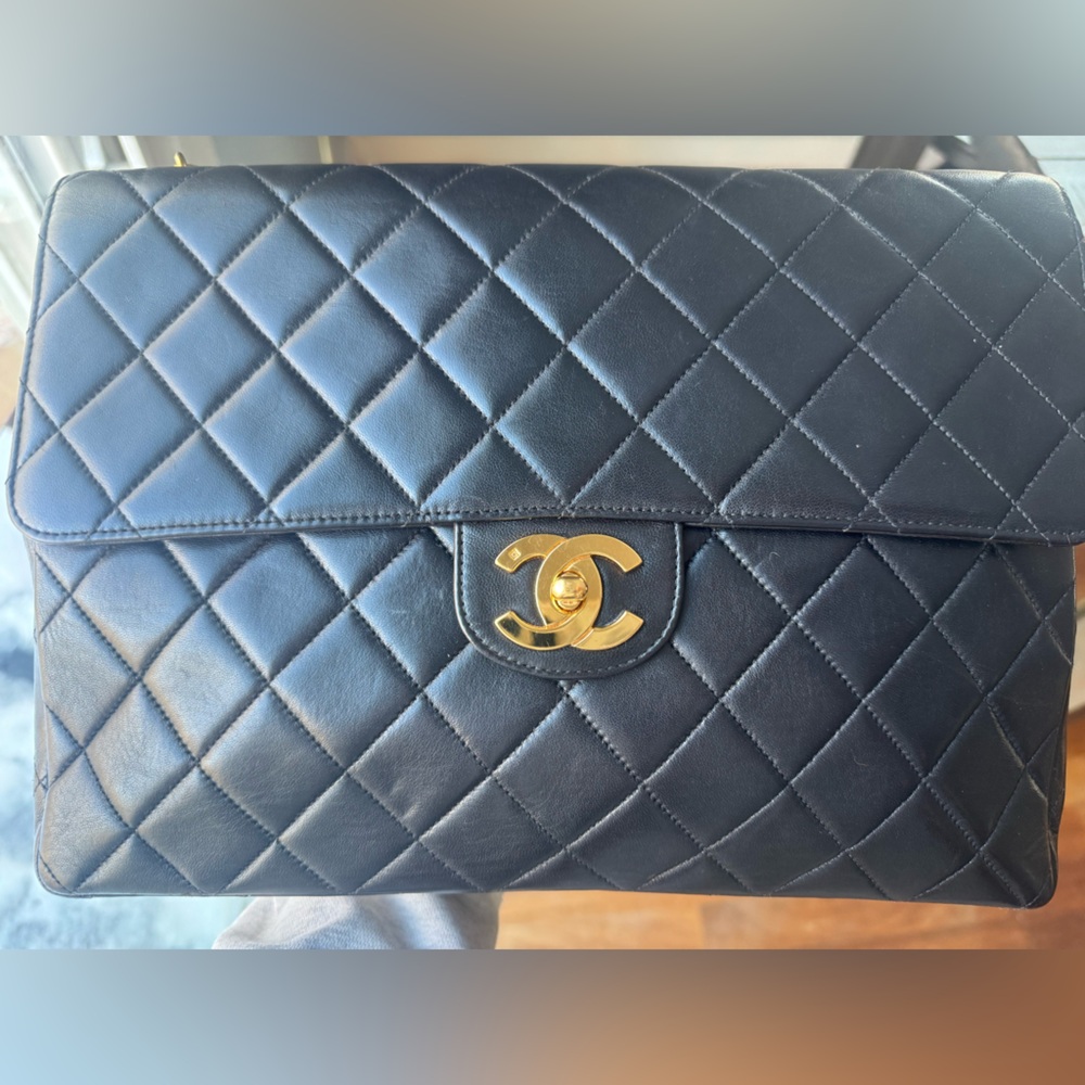 Chanel Jumbo Single Flap in black with gold hardware.